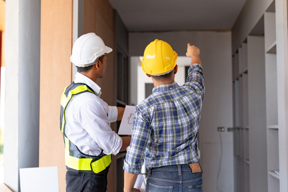 Two,Asian,Male,Engineers,Are,Inspecting,A,Job,Site,And